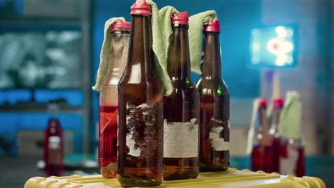 Several petrol bombs rotate in the foreground. Molotov cocktail concept. Stock Footage 100012144