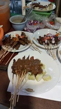 Several plates of satay Stock Photos