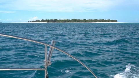 Several Point of view shots moving around a yacht off a tropical paradise. Stock Footage 106869816