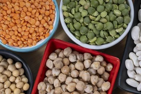 Several pots with raw grains for preparing healthy food Stock Photos