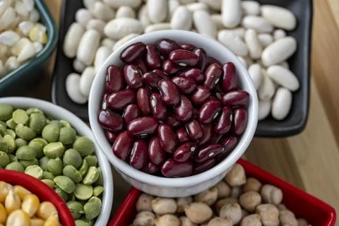Several pots with raw grains for preparing healthy food Stock Photos