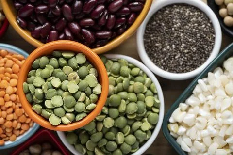 Several pots with raw grains for preparing healthy food Stock Photos