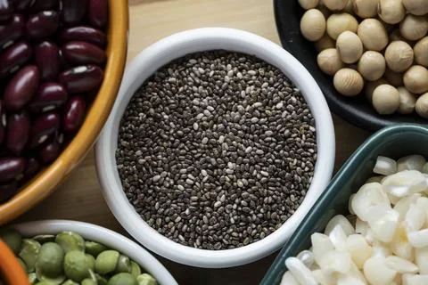 Several pots with raw grains for preparing healthy food Foto stock