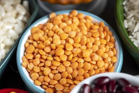 Several pots with raw grains for preparing healthy food Stock Photos