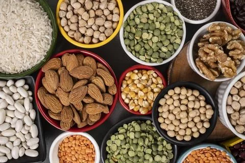 Several pots with raw grains for preparing healthy food Stock Photos
