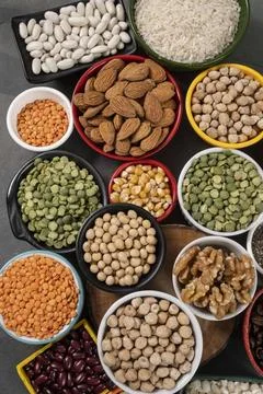 Several pots with raw grains for preparing healthy food Stock Photos