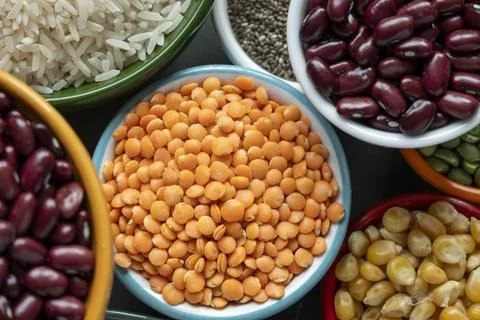 Several pots with raw grains for preparing healthy food Foto stock