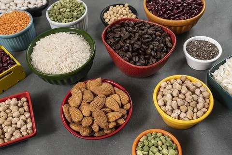 Several pots with raw grains for preparing healthy food Foto stock