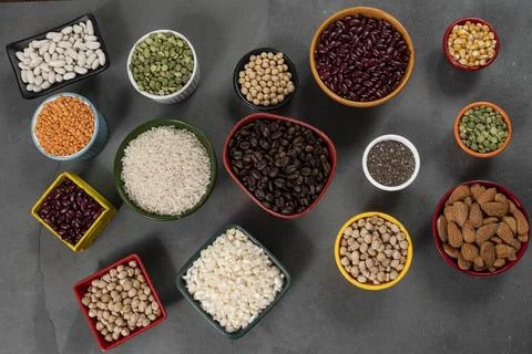 Several pots with raw grains for preparing healthy food Stock Photos
