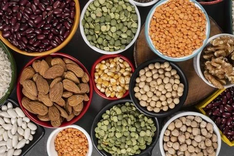 Several pots with raw grains for preparing healthy food Stock Photos