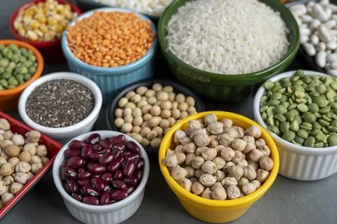 Several pots with raw grains for preparing healthy food Stock Photos