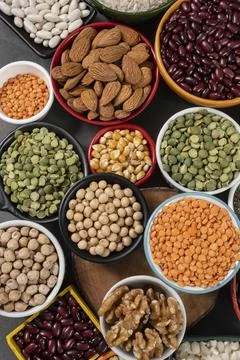 Several pots with raw grains for preparing healthy food Stock Photos