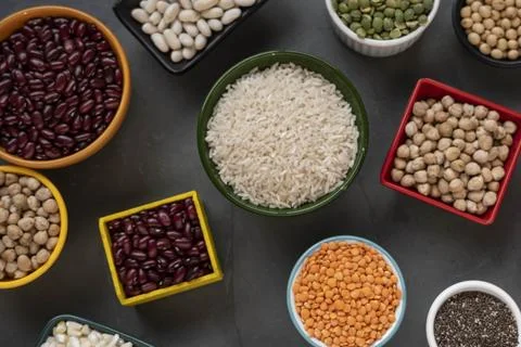 Several pots with raw grains for preparing healthy food Stock Photos