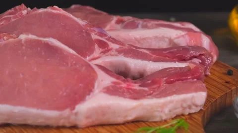 Several raw pork steaks Stock Footage 154631603