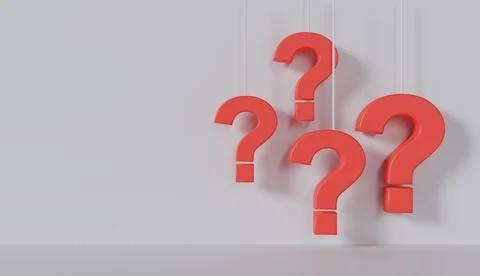Several red question marks hanging from strings in front of a white wall Stock Photos