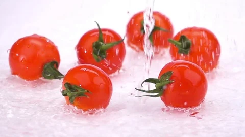 A Several Ripe Tomatoes are Falling on the Table. 스톡 동영상 72840127