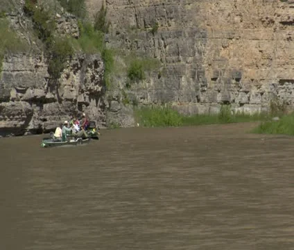 Several river rafts float rocky canyon Video stock 21620139