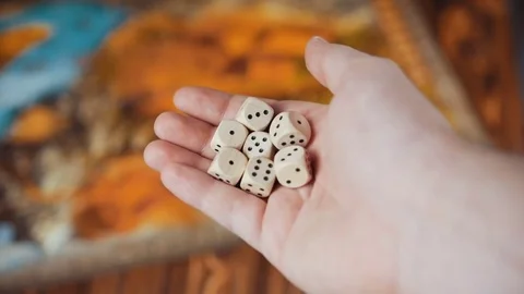 Several Rolling Dices Fall On a Table With Boardgame Stock Footage 72602624