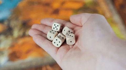 Several Rolling Dices Fall On a Table With Boardgame Stock Footage 72639883