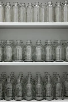 Several rows of empty medical test tubes sit on a shelf in a drug laboratory Fotos de archivo