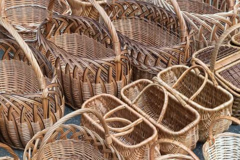Several rows of wicker baskets. Baskets are woven from vines. Stock Photos