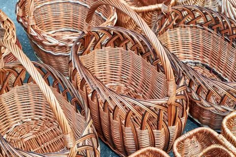 Several rows of wicker baskets. Baskets are woven from vines. Stock Photos