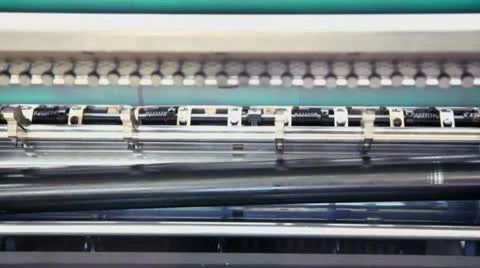 Several shafts spins in machine of printing conveyer Stock Footage 21241812