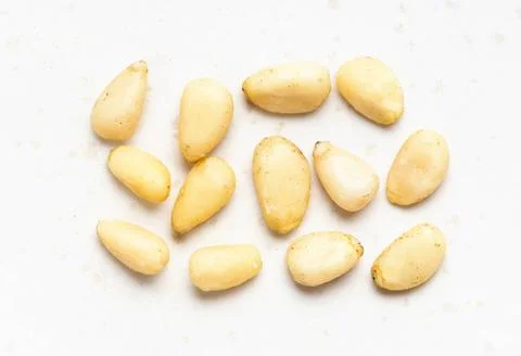 Several shelled pine nuts close up on gray several shelled pine nuts close... Foto stock