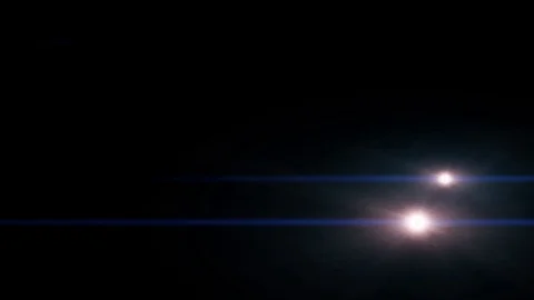 Several shining lights moving from right to left on black background in 4k Stock Footage 115697877