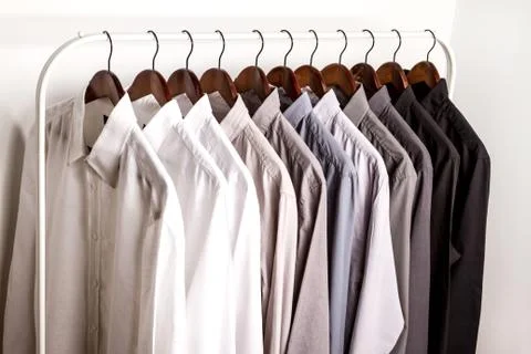 Several shirts on a hanger. Stock Photos