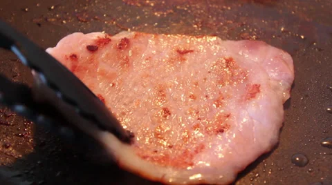 Several shots of a bacon rasher being cooked in a frying pan Stock Footage 36150837