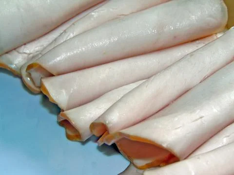 Several slices of ham on a plate 스톡 사진