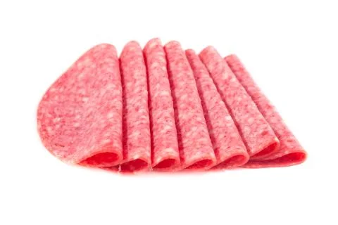 Several slices of salami isolated Stock Photos