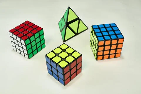 Several solved rubik's cubes on white background Stock Photos