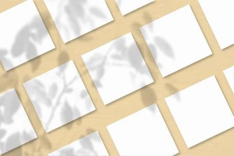 Several square sheets of white textured paper against a peach wall background Stock Illustration