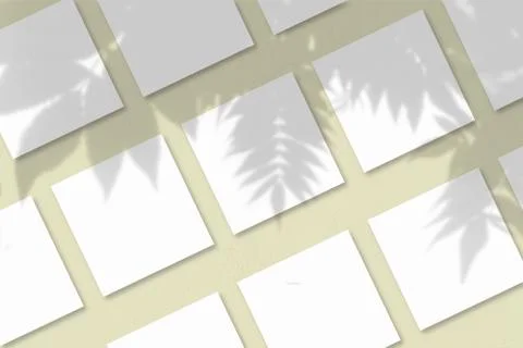 Several square sheets of white textured paper against a yellow wall backgroun Stock Illustration