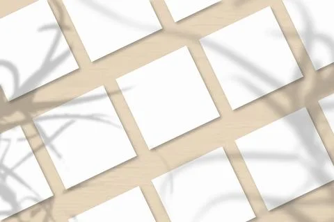 Several square sheets of white textured paper against a orange wall backgroun Stock Illustration