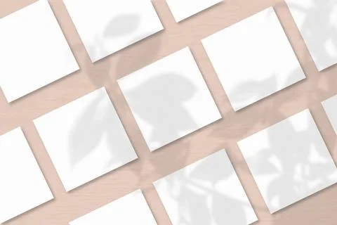 Several square sheets of white textured paper against a pink wall background. Stock Illustration