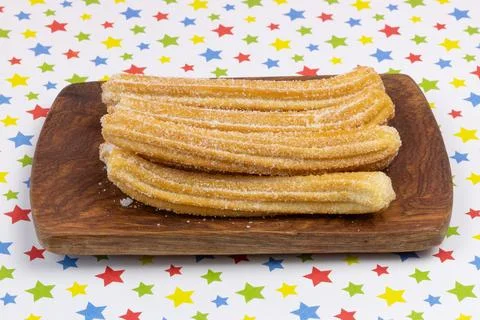 Several stacked churros, close-up Stock Photos