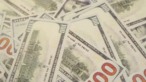 Several stacks of american dollar bills taken from above and rotated slowly.. Stock Footage 308878664