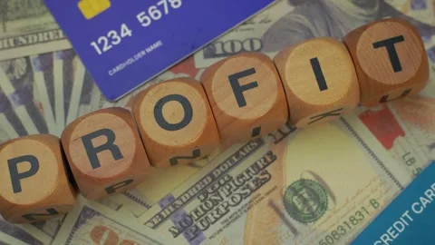 Several stacks of hundred dollar bills, some credit cards and some blocks w.. Stock Footage 308878699