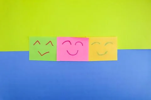 Several sticky notes with 3 expressions drawn with red and green markers on a Stock Photos