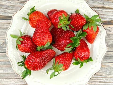 Several strawberries, close-up, on a table Stock Photos