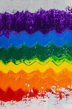 Several strokes of multi-colored paint depict a frag of the LGBT community on Stock Photos