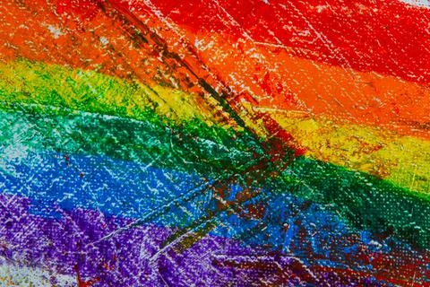 Several strokes of multi-colored paint depict a frag of the LGBT community on Stock Photos