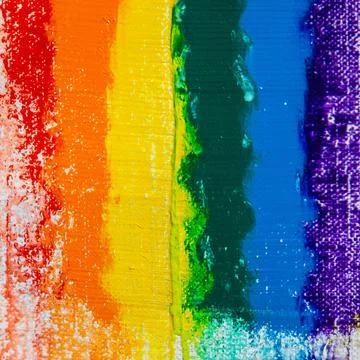 Several strokes of multi-colored paint depict a frag of the LGBT community on Stock Photos