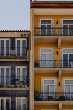Several structures in yellow and blue with balconies Stock Photos