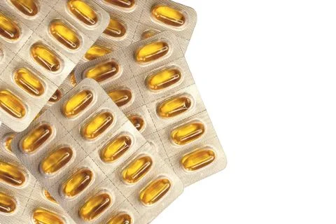 Several tablets of soft capsules on top of each other.Copy space Stock Photos