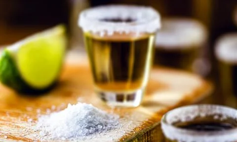 Several tequila glasses, the most consumed drink in mexico Stock Photos