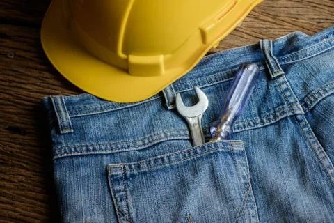 Several tools on a denim workers pocket Stock Photos